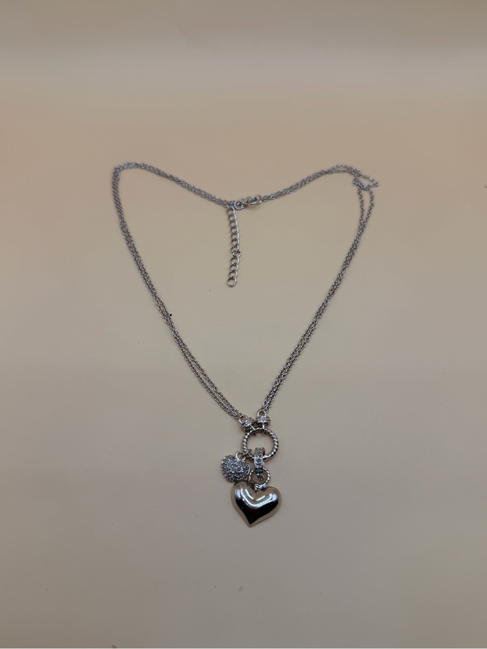 925 Sterling Silver .25 Ctw Diamond Hearts Necklace 16” to 18”.